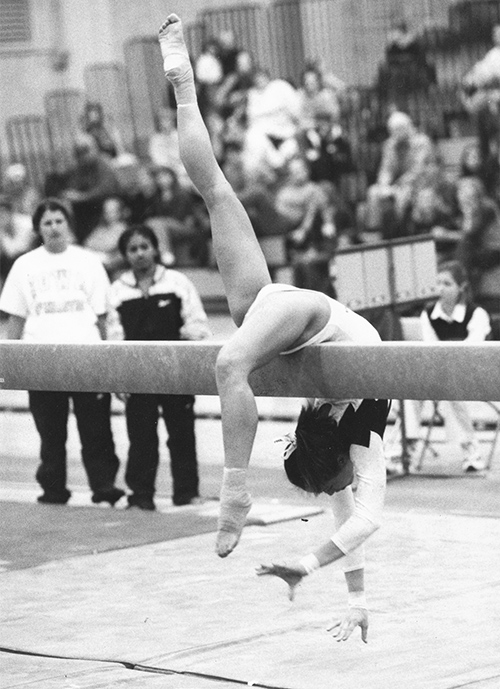 Betsy Lam doing gymnastics on the balance beam